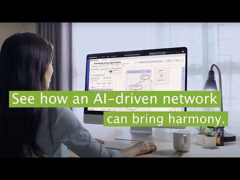 The title slide from the video. In the background is a woman sitting at a desk looking at a computer monitor screen. Over that are the words, “See how and AI-driven network can bring harmony.”